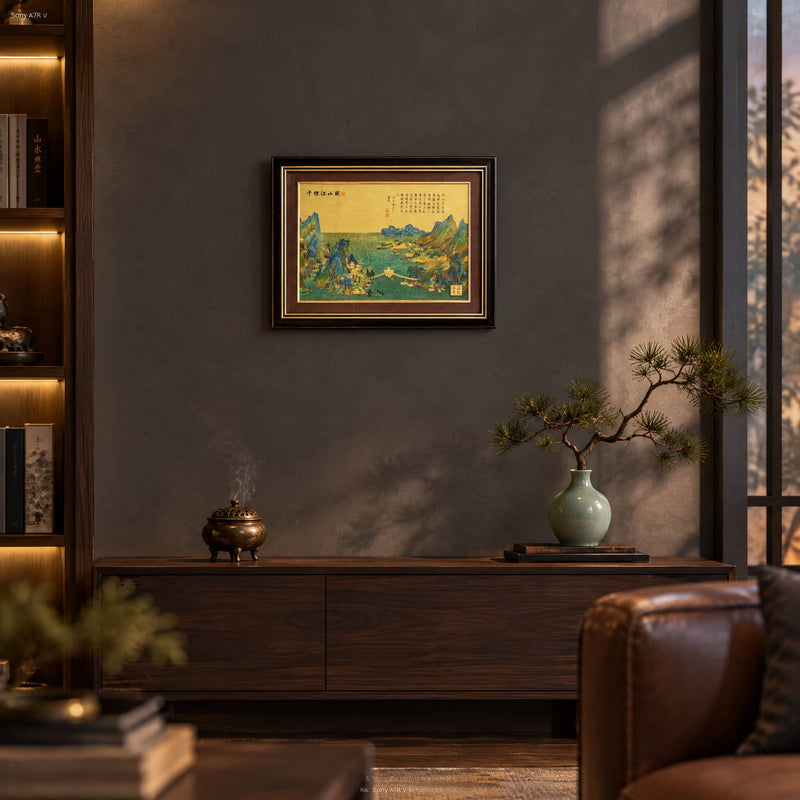 Chinese Landscape artwork displayed on a wall above a wooden console in a warmly lit office