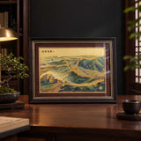 Great Wall artwork displayed on a wooden desk in a warmly lit office
