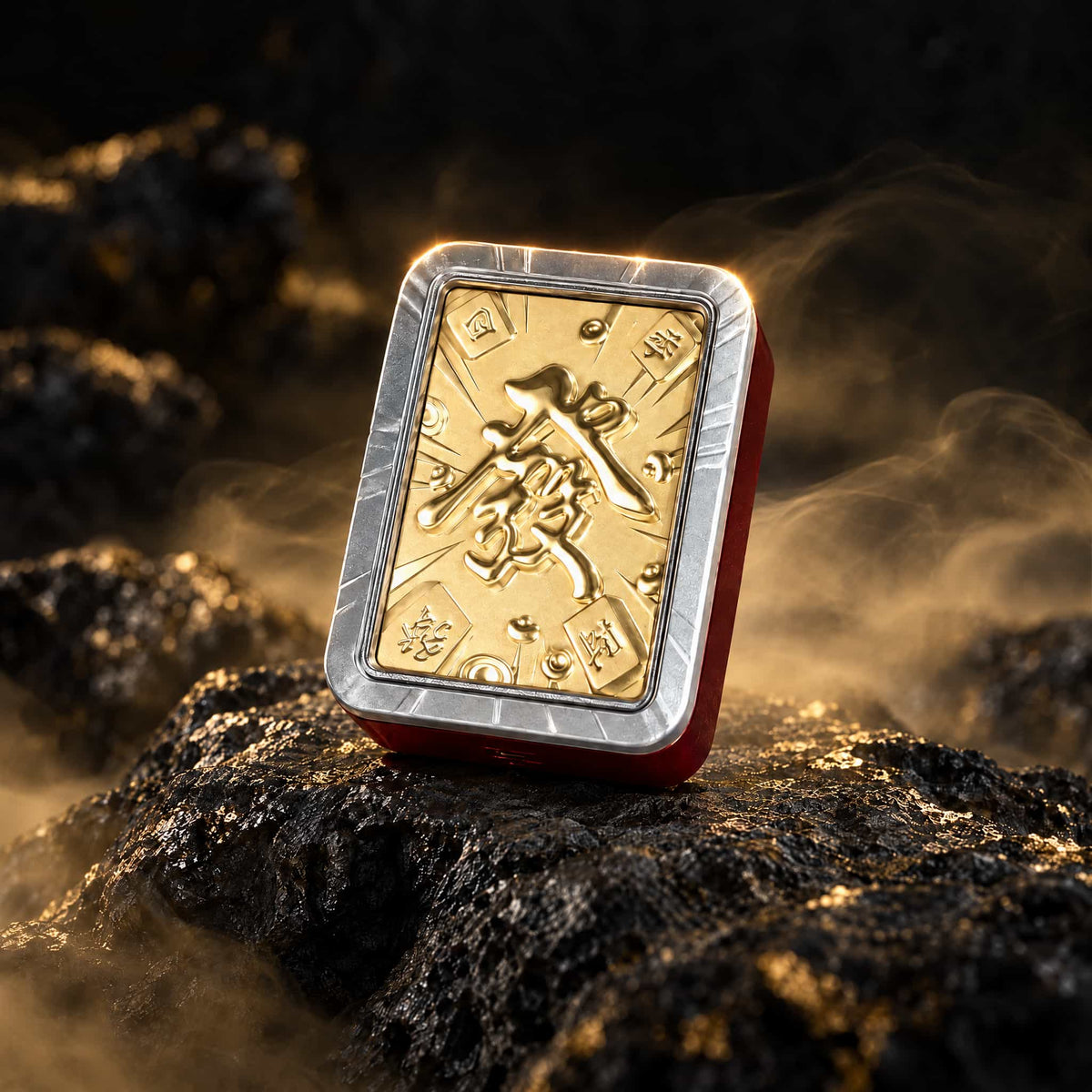 Mahjong car diffuser with a gold Fa character and silver-tone frame on a dark rock surface.