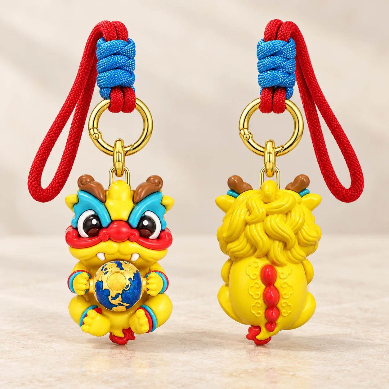 Front and reverse details of the colourful Dragon Charm, showing the globe and sculpted back